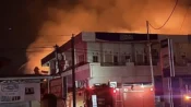 Petugas memadamkan kebakaran gudang produk Indofood di Jalan G. Obos Palangka Raya